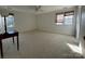 Spacious bedroom with plush carpeting, a ceiling fan, and two large windows at 944 Evian Ln, Matthews, NC 28015