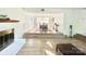 Inviting dining area with hardwood floors and a step-down transition to a cozy living space at 944 Evian Ln, Matthews, NC 28015