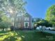 Charming brick home featuring a well-manicured lawn and a traditional architectural style at 944 Evian Ln, Matthews, NC 28015