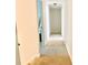 Hallway featuring neutral walls and carpeting with several doorways leading to rooms at 944 Evian Ln, Matthews, NC 28015