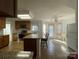 Modern kitchen with stainless steel appliances, granite countertops, and a breakfast bar for casual dining at 944 Evian Ln, Matthews, NC 28015