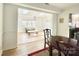 Bright living space with skylights, hardwood floors, and seamless transition to dining area at 944 Evian Ln, Matthews, NC 28015