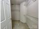 Walk-in closet featuring ample shelving and storage space, ready for organization at 944 Evian Ln, Matthews, NC 28015
