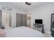 Bright bedroom featuring a work desk and a door to the attached bathroom at 1000 E Woodlawn Rd # 315, Charlotte, NC 28209