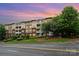 Charming multi-story condo building with well-maintained landscaping and private balconies at 1000 E Woodlawn Rd # 315, Charlotte, NC 28209