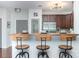 Modern kitchen with a breakfast bar and stainless steel appliances at 1000 E Woodlawn Rd # 315, Charlotte, NC 28209
