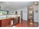 Open-concept kitchen with granite counters and stainless steel dishwasher at 1000 E Woodlawn Rd # 315, Charlotte, NC 28209