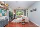 Cozy living room features a large window and a comfortable sectional sofa at 1000 E Woodlawn Rd # 315, Charlotte, NC 28209