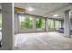 Well-lit parking garage with windows overlooking lush greenery at 1000 E Woodlawn Rd # 315, Charlotte, NC 28209