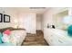 Bright bedroom featuring a comfortable bed, a white dresser and hardwood floors at 1007 20Th Avenue Se Loop, Hickory, NC 28602