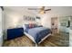 Comfortable bedroom with ample natural light, ceiling fan, and en suite bathroom at 1007 20Th Avenue Se Loop, Hickory, NC 28602