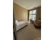 Bright bedroom with a daybed, large window, and ample natural light, ideal for relaxation at 1049 Park West Dr, Charlotte, NC 28209