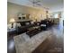 Inviting living room featuring hardwood floors, and neutral walls, flowing into an eat-in kitchen, great for entertaining at 1049 Park West Dr, Charlotte, NC 28209