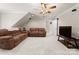 A finished basement provides a comfortable entertainment area with plush seating at 105 Walnut Hill Ct, Mooresville, NC 28115