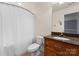Cozy bathroom with granite countertop, updated vanity, toilet, and shower with curtain at 105 Walnut Hill Ct, Mooresville, NC 28115