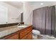 A well-lit bathroom features a granite countertop, ample storage, and neutral color palette at 105 Walnut Hill Ct, Mooresville, NC 28115