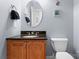 Charming half bathroom featuring a vanity with granite countertop at 105 Walnut Hill Ct, Mooresville, NC 28115