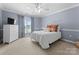 This cozy bedroom is bathed in natural light with its soothing color palette at 105 Walnut Hill Ct, Mooresville, NC 28115