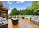 Spacious deck with patio furniture overlooking a beautiful backyard and inground pool at 105 Walnut Hill Ct, Mooresville, NC 28115