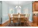 Inviting dining area with bright natural light and traditional furnishings at 105 Walnut Hill Ct, Mooresville, NC 28115