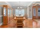 Classic dining room with hardwood floors and a large window at 105 Walnut Hill Ct, Mooresville, NC 28115