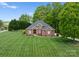 Beautifully landscaped front yard with a well-maintained lawn and inviting curb appeal at 105 Walnut Hill Ct, Mooresville, NC 28115