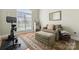 Cozy living room area with neutral tones, natural light, and comfortable seating at 105 Walnut Hill Ct, Mooresville, NC 28115