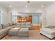 Bright living area offers hardwood floors and view into the kitchen space perfect for gathering at 105 Walnut Hill Ct, Mooresville, NC 28115