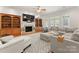 Cozy living room featuring built-in bookshelves, fireplace, and a comfortable seating area at 105 Walnut Hill Ct, Mooresville, NC 28115