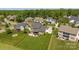 This aerial view shows a home with a well-manicured lawn and patio, nestled in a suburban neighborhood at 10517 Sable Cap Rd, Mint Hill, NC 28227