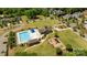 This aerial view features a pool, playground, and clubhouse in a well-maintained community setting at 10517 Sable Cap Rd, Mint Hill, NC 28227