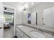 Bathroom with double sinks, vanity, and bathroom with bedroom access at 10517 Sable Cap Rd, Mint Hill, NC 28227