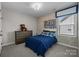 Cozy bedroom features a charming brick accent wall and comfortable furnishings at 10517 Sable Cap Rd, Mint Hill, NC 28227