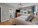 Inviting bedroom with a view of the lake at 10517 Sable Cap Rd, Mint Hill, NC 28227