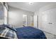 Inviting bedroom with plush bedding, closet access, and a bathroom at 10517 Sable Cap Rd, Mint Hill, NC 28227