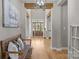 Entryway with wooden floors, wooden beams, and front door at 10517 Sable Cap Rd, Mint Hill, NC 28227