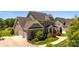 Charming two-story home with a three car garage, landscaped yard, and inviting entrance at 10517 Sable Cap Rd, Mint Hill, NC 28227