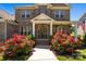 View of home with decorative entryway and colorful landscaping at 10517 Sable Cap Rd, Mint Hill, NC 28227
