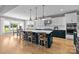 Modern kitchen with large island with seating, stainless appliances and adjacent breakfast nook at 10517 Sable Cap Rd, Mint Hill, NC 28227