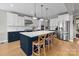 Modern kitchen with a large island, stainless steel appliances, and ample counter space at 10517 Sable Cap Rd, Mint Hill, NC 28227