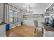 Bright office with hardwood floors, large window, and custom built-in shelving at 10517 Sable Cap Rd, Mint Hill, NC 28227