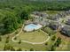 Aerial view of community pool and surrounding homes with ample green space and convenient parking at 1107 Castle Rd, Indian Land, SC 29707