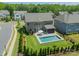 Aerial view of a home with a backyard swimming pool and well-manicured lawn at 1107 Castle Rd, Indian Land, SC 29707