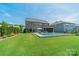 Expansive backyard featuring a swimming pool, well-maintained lawn, and elegant landscaping at 1107 Castle Rd, Indian Land, SC 29707
