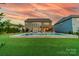 Expansive backyard with a well-maintained lawn and a luxurious in-ground pool, perfect for outdoor enjoyment at 1107 Castle Rd, Indian Land, SC 29707