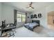 Bedroom with gray walls, a window with natural light, sports memorabilia and a desk at 1107 Castle Rd, Indian Land, SC 29707