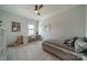Cozy bedroom with a ceiling fan, a workspace by the window, a bed, and neutral decor at 1107 Castle Rd, Indian Land, SC 29707