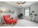 Bedroom featuring a ceiling fan, desk, red chair and colorful curtains at 1107 Castle Rd, Indian Land, SC 29707