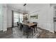 A well-lit dining room featuring neutral decor, wainscoting, and a modern chandelier at 1107 Castle Rd, Indian Land, SC 29707