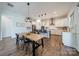 Modern kitchen with stainless steel appliances, a center island, a breakfast bar, and an adjacent dining area at 1107 Castle Rd, Indian Land, SC 29707